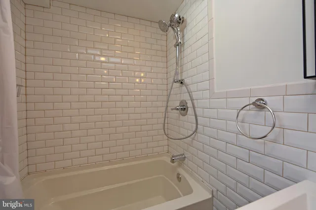 a balcony with a table and chairs