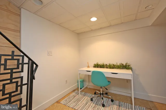 a living room with a couch and a flat screen tv
