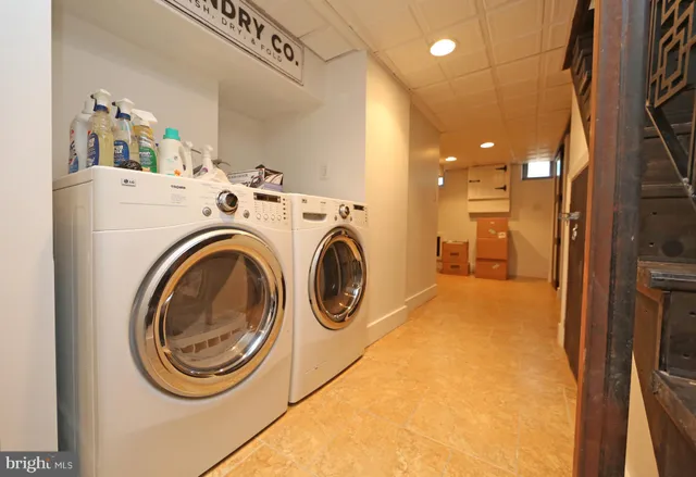a living room with furniture and flat screen tv