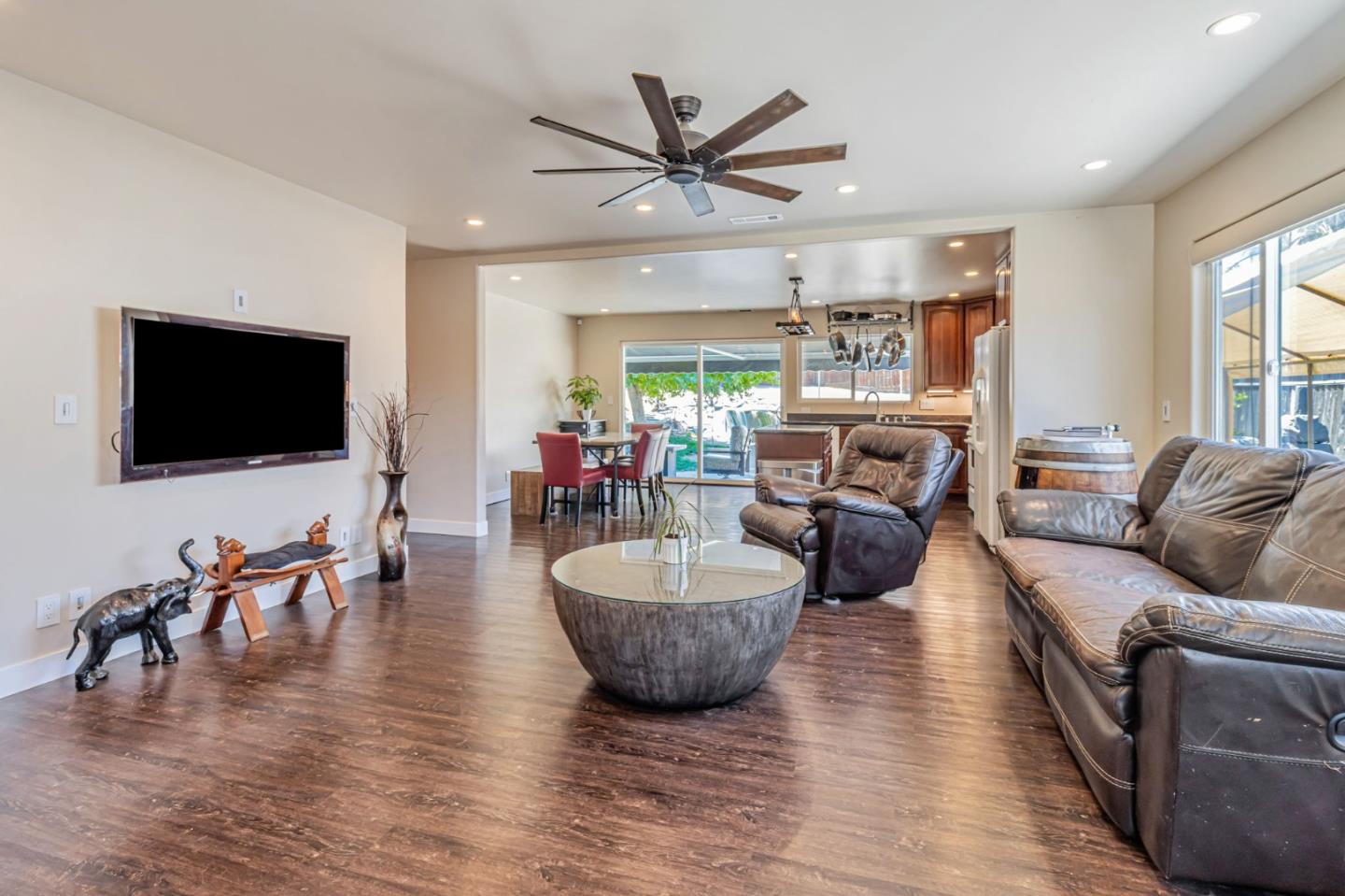 321 Vineyard Drive San Jose, CA 95119 - Photo 2 of 29 a living room with furniture and a flat screen tv