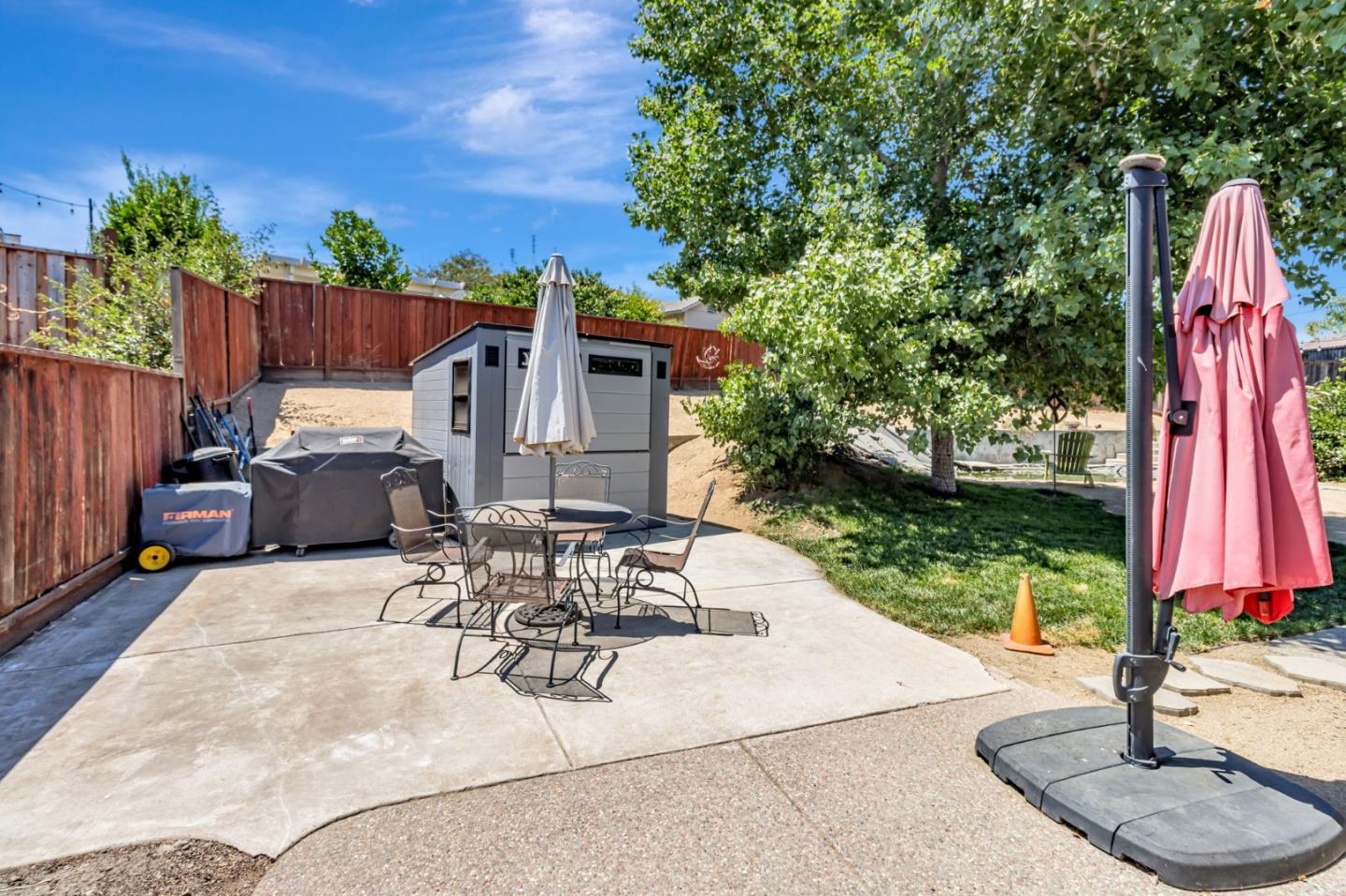 321 Vineyard Drive San Jose, CA 95119 - Photo 24 of 29 a view of a patio with table and chairs potted plants and large tree