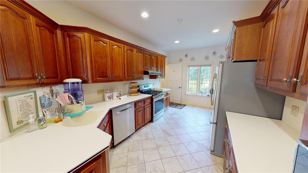 331 Belmont Road Butler, PA 16001 - Photo 8 of 25 a kitchen that has a sink and a stove in it