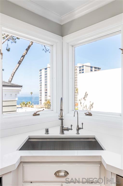 862 Prospect Street, Unit 1 La Jolla, CA 92037 - Photo 11 of 25 a bathroom with a sink and a window