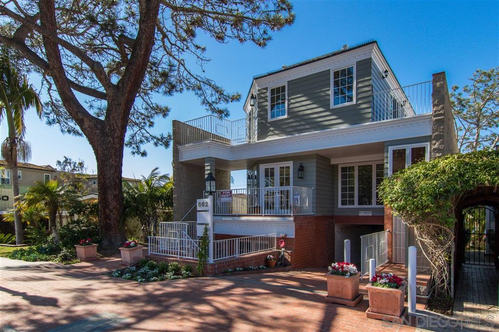 862 Prospect Street, Unit 1 La Jolla, CA 92037 - Photo 2 of 25 a front view of a house with a tree