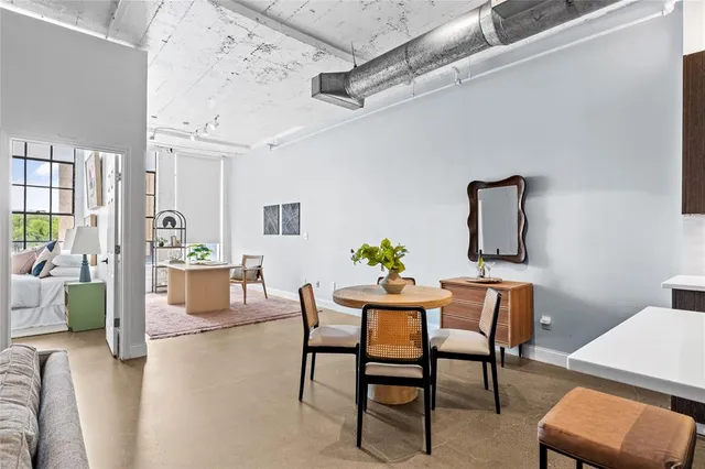a view of a livingroom with furniture and a potted plant