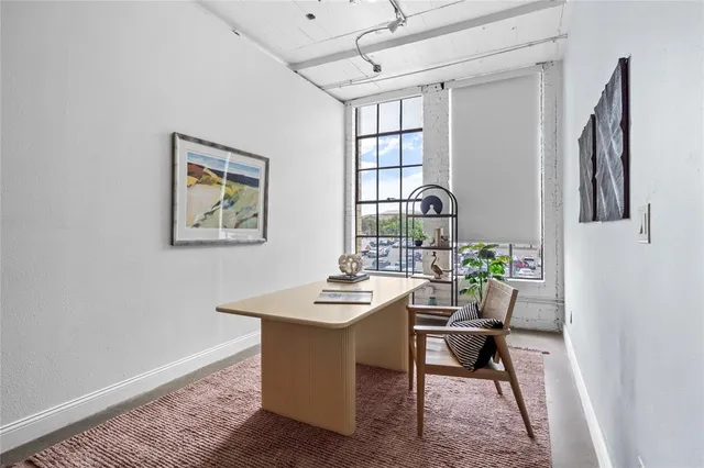 a workspace with furniture and window