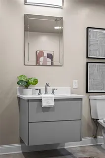 a room with a table and a potted plant