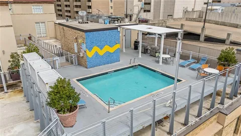 an aerial view of a house with swimming pool