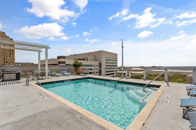 a view of a swimming pool with a lounge chair
