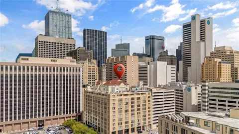 a front view of a residential apartment building with iron fence