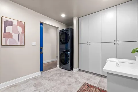 a view of a storage & utility room with closet dryer