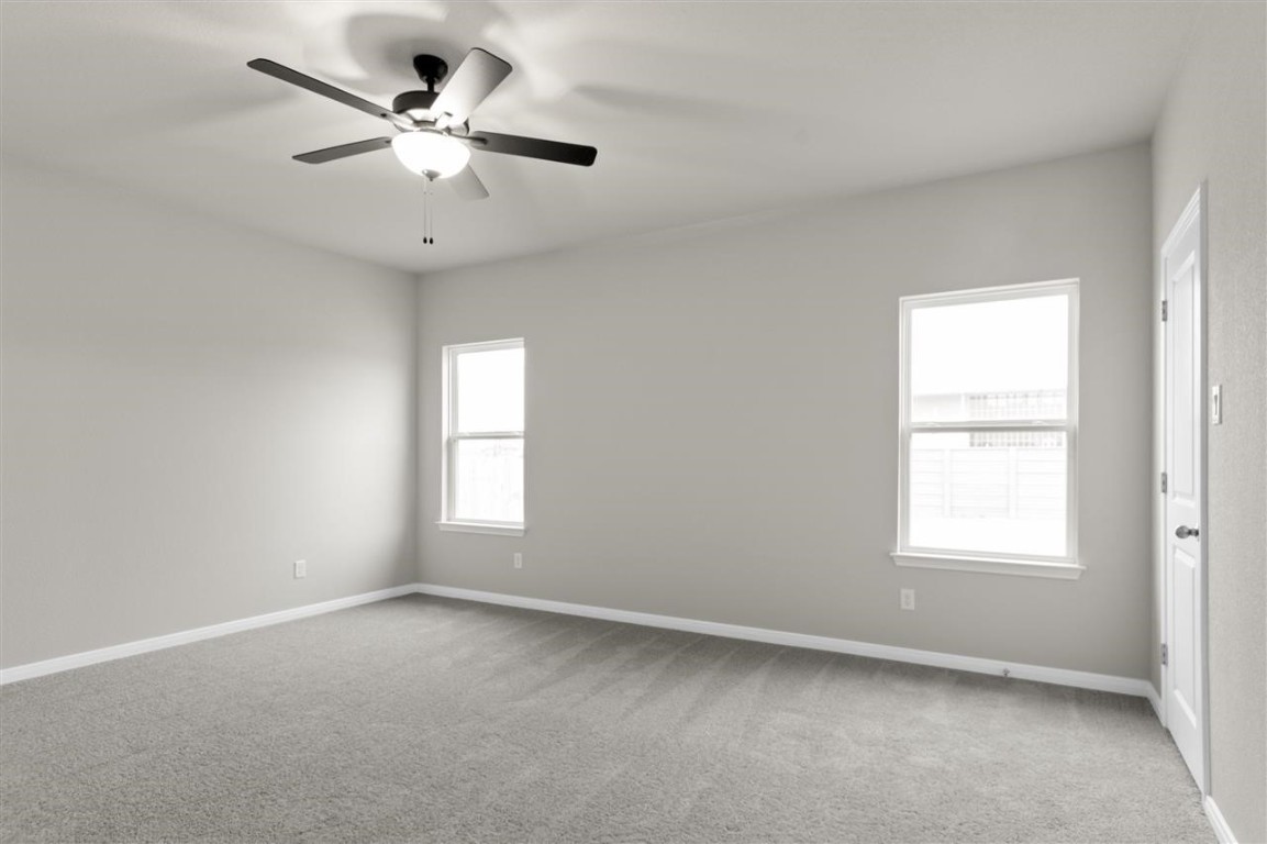 116 Outlaw Drive Jarrell, TX 76537 - Photo 12 of 25 an empty room with a window and a fan