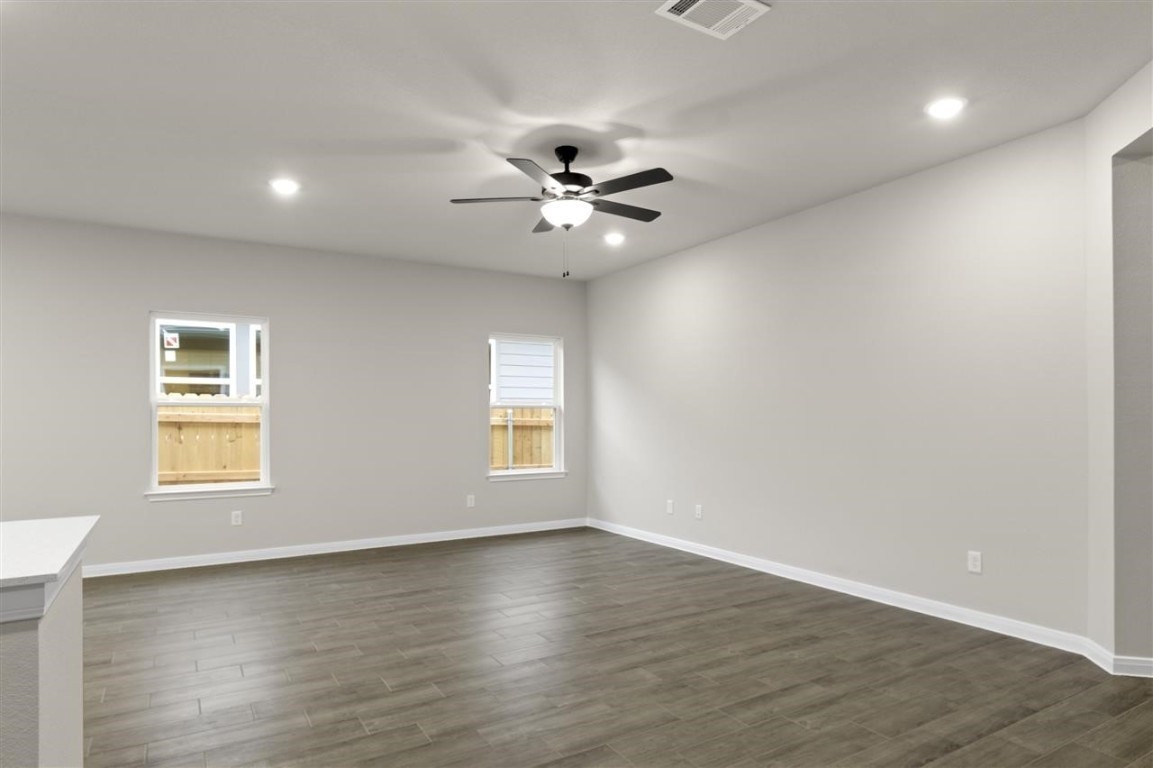 116 Outlaw Drive Jarrell, TX 76537 - Photo 4 of 25 a view of a room with a window and wooden floor
