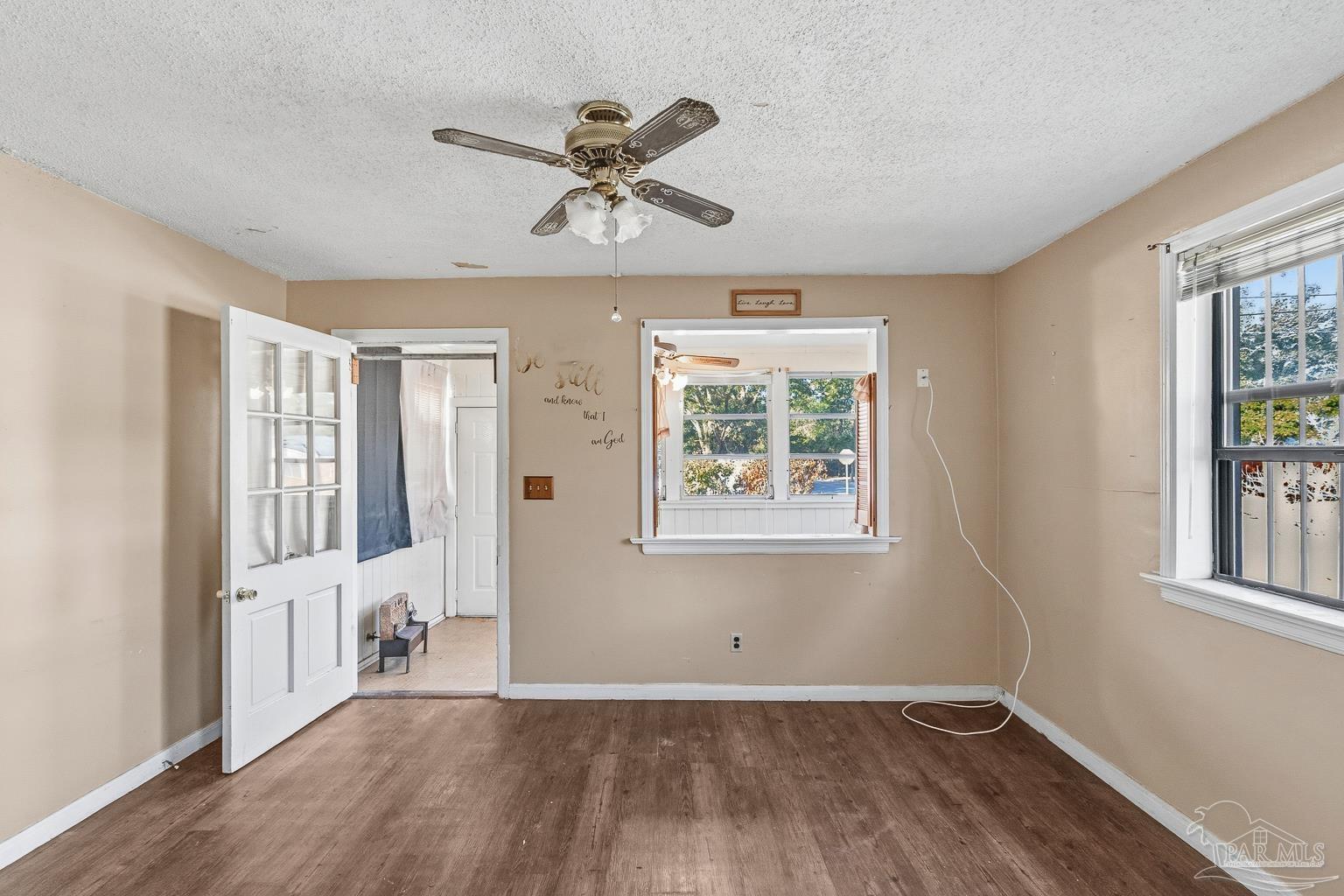 1920 North Spring Street Pensacola, FL 32501 - Photo 12 of 43 wooden floor in an empty room with a window