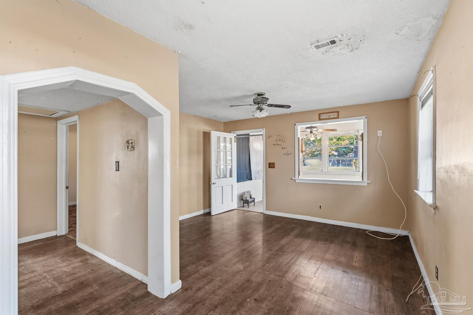 1920 North Spring Street Pensacola, FL 32501 - Photo 13 of 43 a view of an empty room with wooden floor and a window
