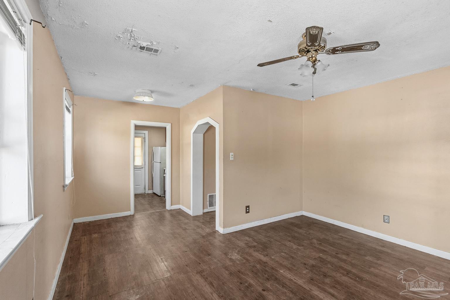 1920 North Spring Street Pensacola, FL 32501 - Photo 14 of 43 wooden floor in an empty room with a window