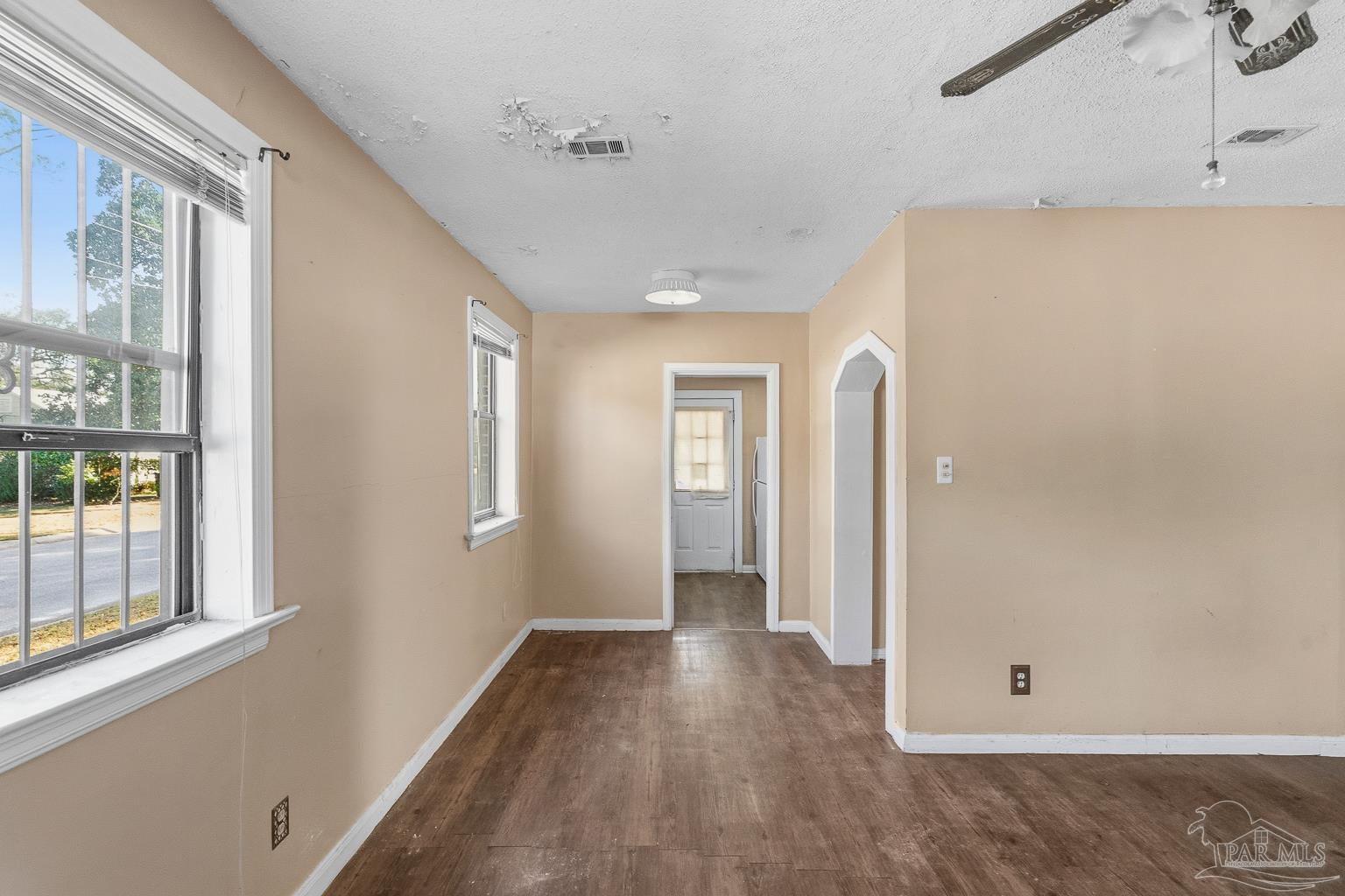 1920 North Spring Street Pensacola, FL 32501 - Photo 15 of 43 a view of a hallway with wooden floor and a bathroom
