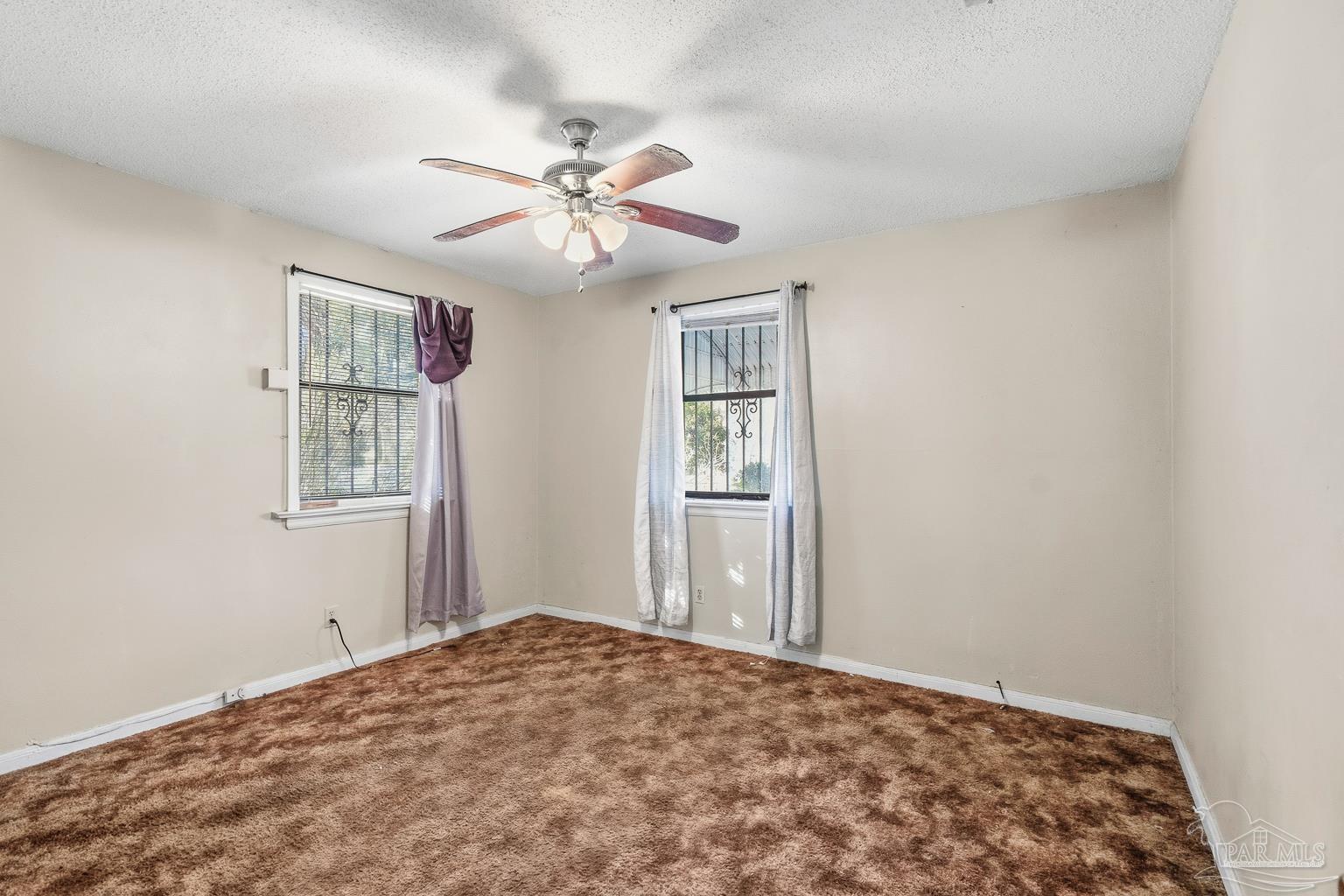 1920 North Spring Street Pensacola, FL 32501 - Photo 24 of 43 a bedroom with a bed and a window