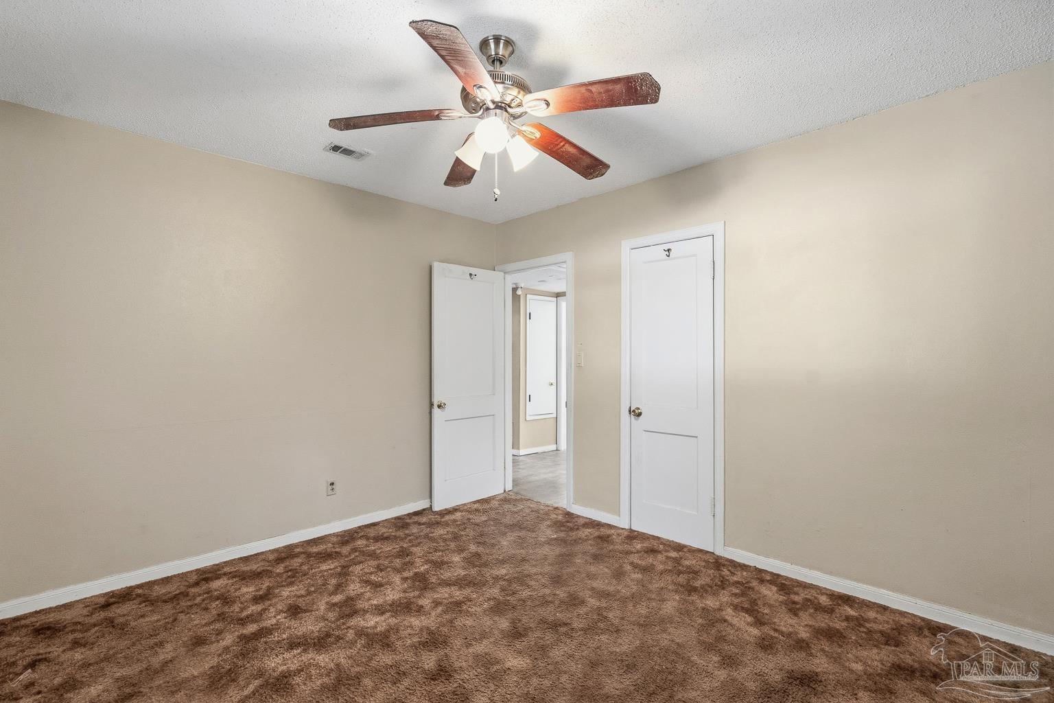 1920 North Spring Street Pensacola, FL 32501 - Photo 25 of 43 an empty room with closet and ceiling fan