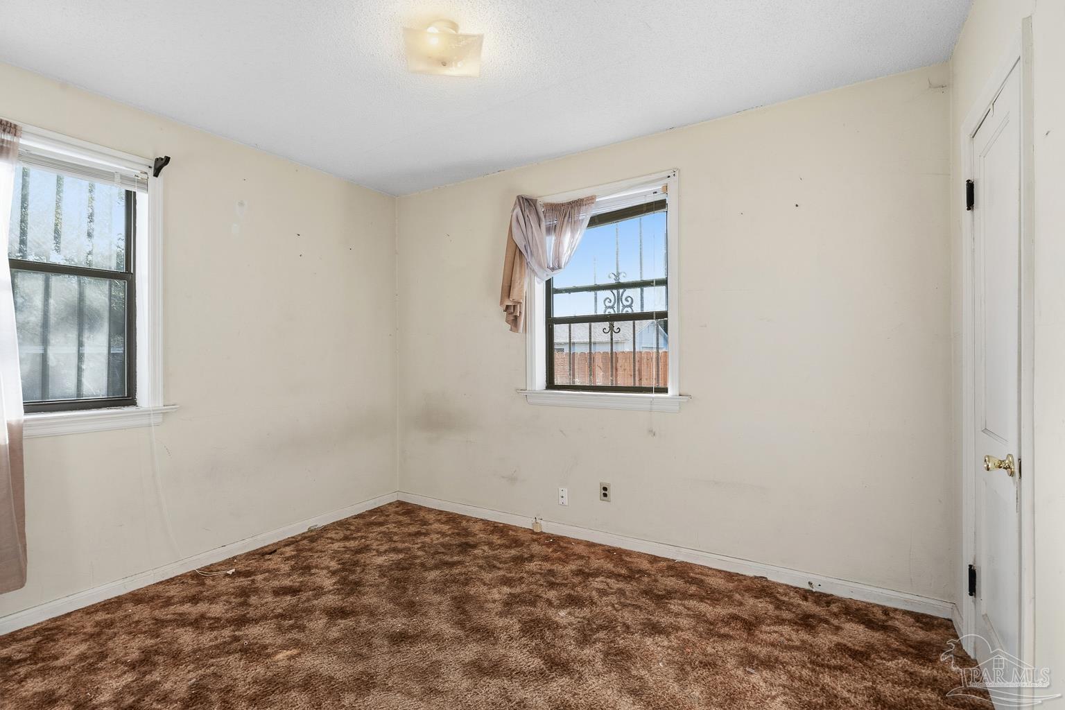 1920 North Spring Street Pensacola, FL 32501 - Photo 27 of 43 a view of a bedroom with a bed and a window