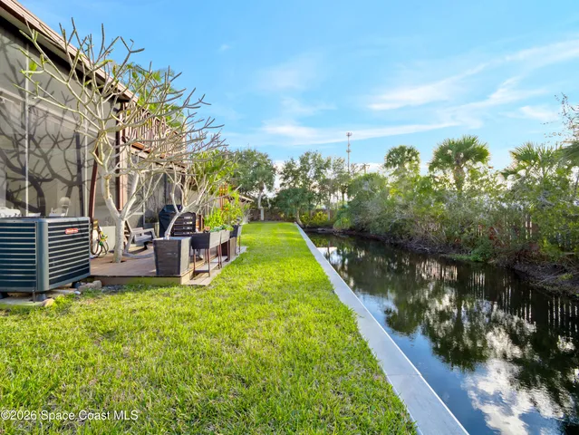 a view of a garden with wooden fence