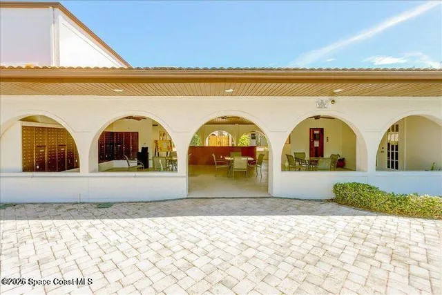 a view of two couches with wooden floor