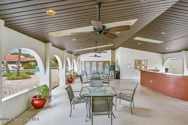 a dining room with furniture and window