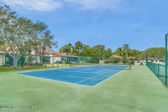 a view of an outdoor space and basketball court