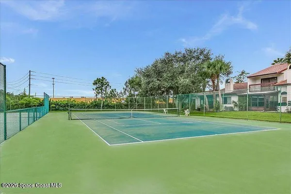 a view of a playground and basketball court