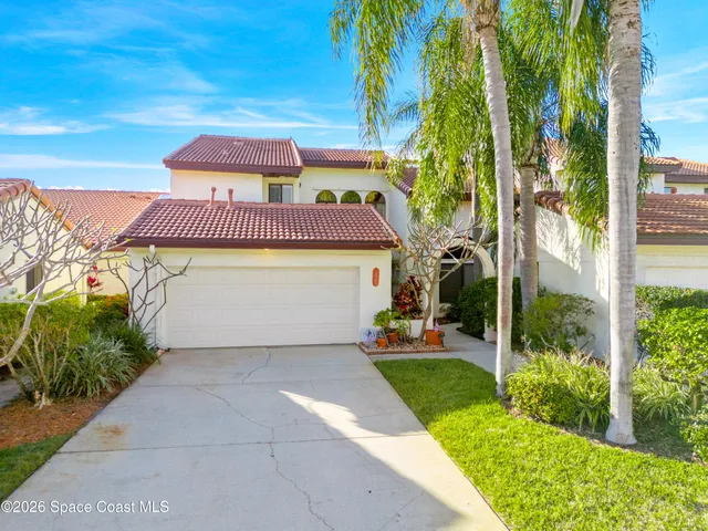 a aerial view of a house with a yard