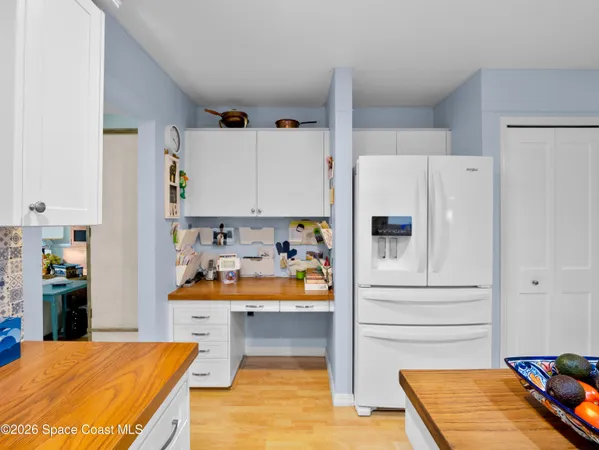 a kitchen with stainless steel appliances refrigerator and cabinets