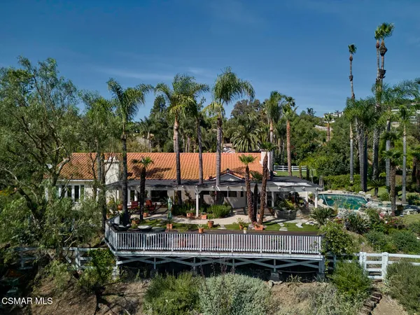 a view of swimming pool with sitting area