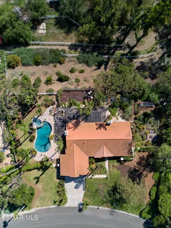 an aerial view of a houses with yard