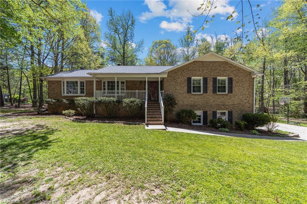 Beautiful single-story ranch home with finished basement nestled on a 1.25-acre lot in the heart of Summerfield.