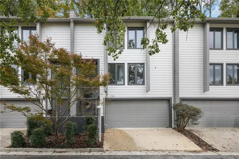 a front view of a house with garage