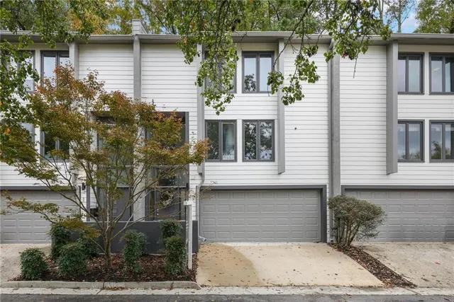 a front view of a house with garage