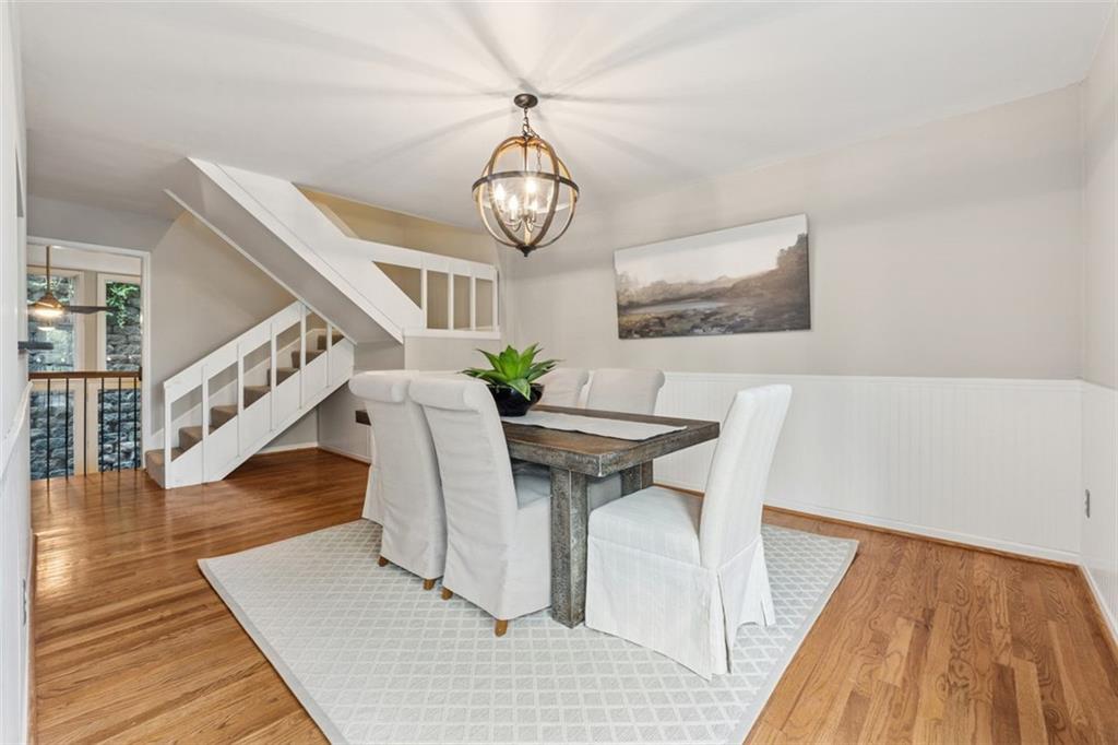4010 Roswell Road Northeast, Unit A2 Atlanta, GA 30342 - Photo 11 of 32 a view of a dining room with furniture wooden floor and front door