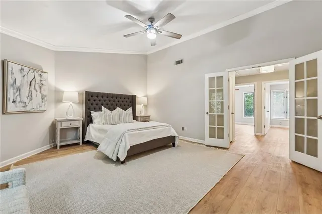 a bed room with a bed and a chandelier