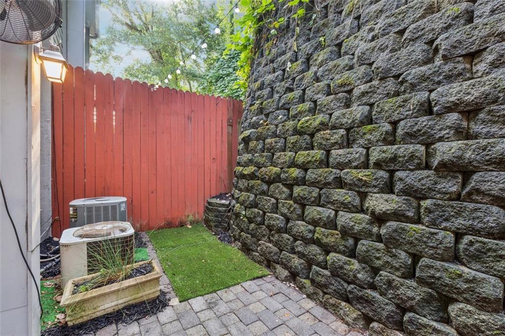 4010 Roswell Road Northeast, Unit A2 Atlanta, GA 30342 - Photo 23 of 32 a view of a backyard with wooden fence
