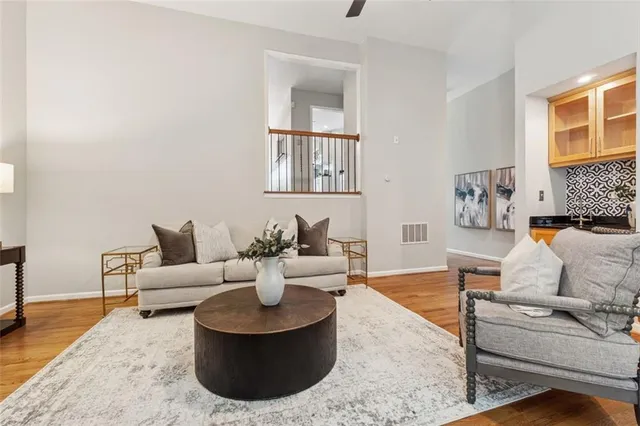 a living room with furniture and a rug