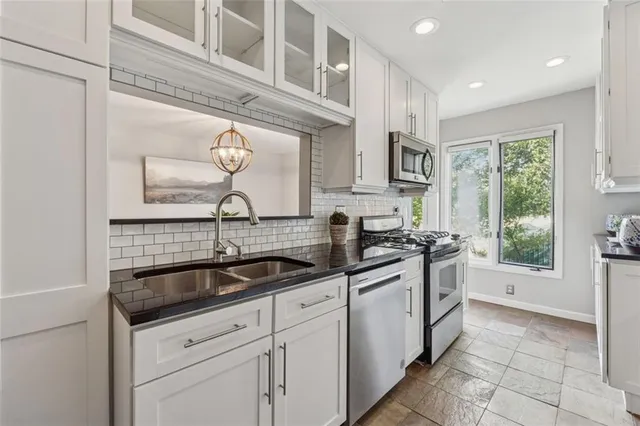 a kitchen with a sink and cabinets