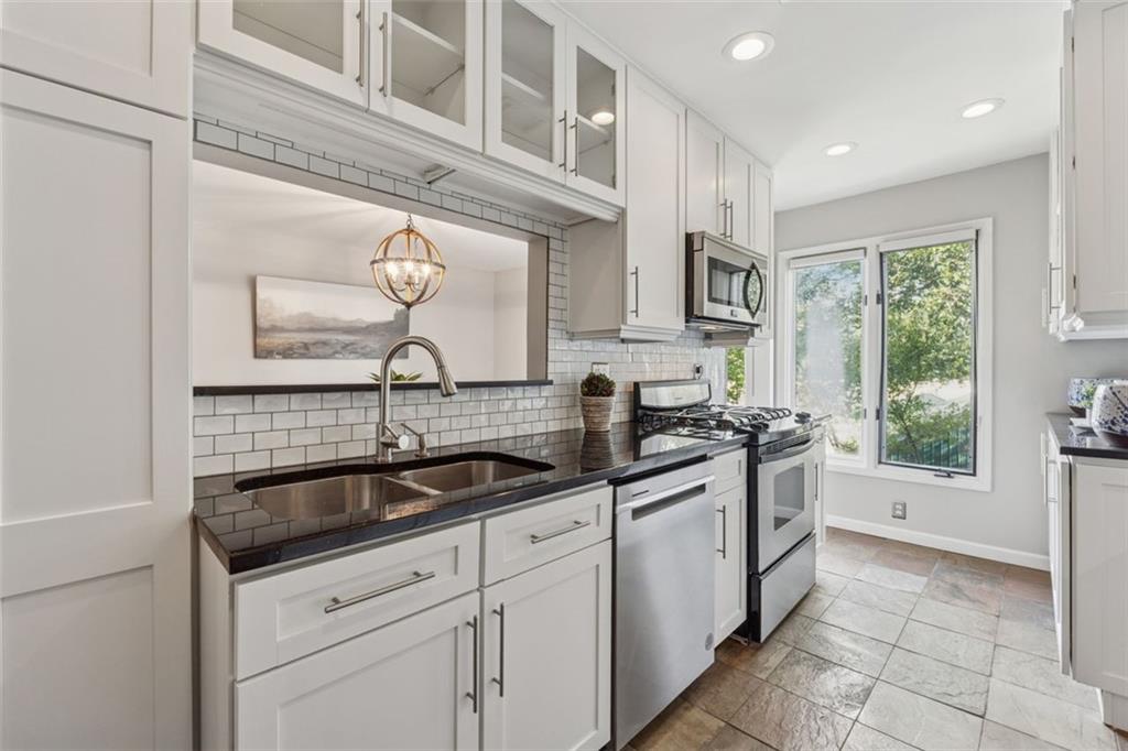 4010 Roswell Road Northeast, Unit A2 Atlanta, GA 30342 - Photo 9 of 32 a kitchen with a sink and cabinets