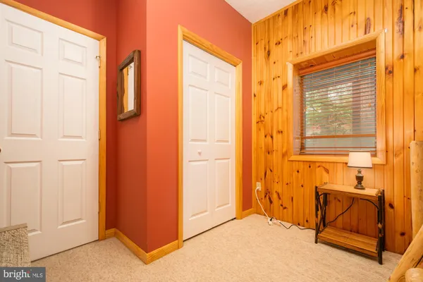 a living room with furniture and a lamp