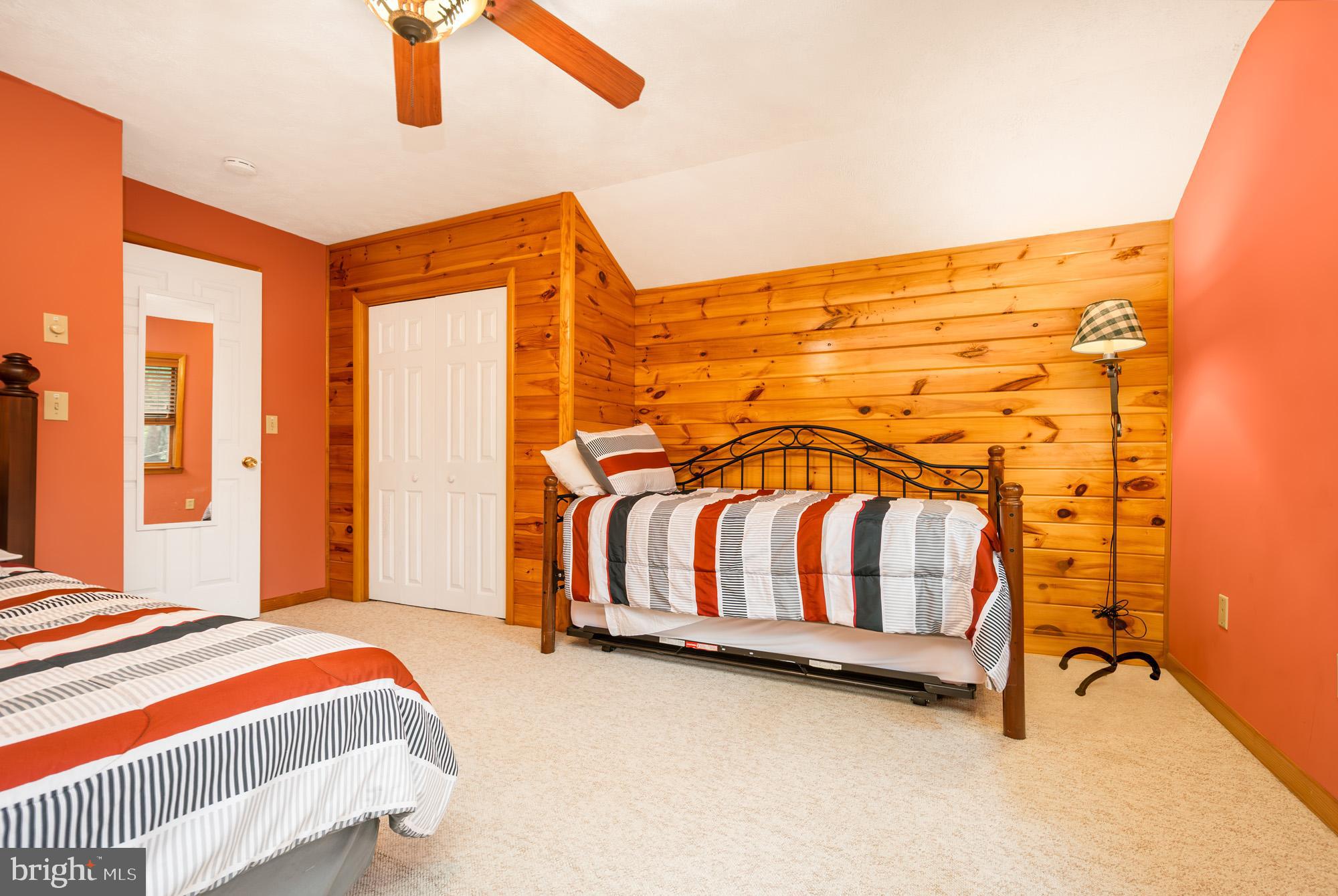 60 Barbaras Way McHenry, MD 21541 - Photo 38 of 51 a bedroom with a bed and painting on the wall