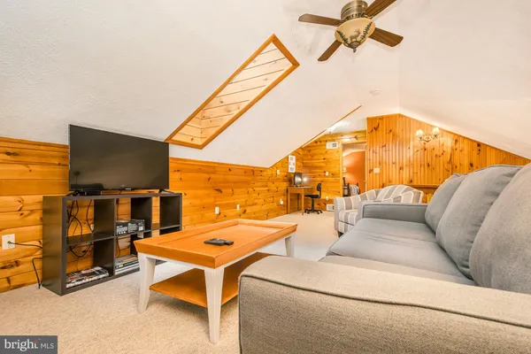 a view of a bathroom with a walk in closet