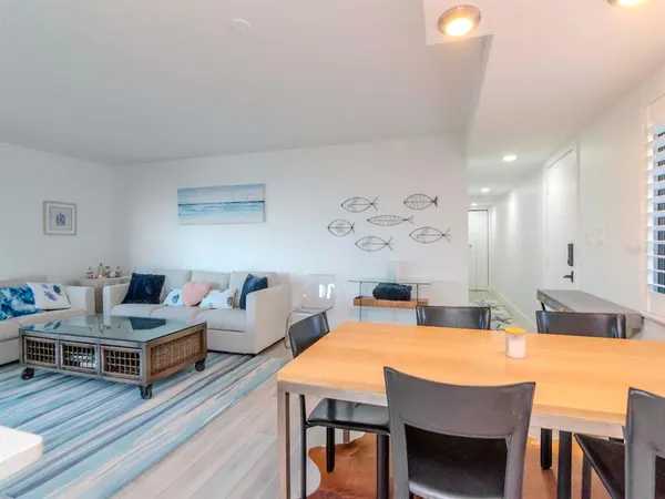 a kitchen with stainless steel appliances a stove a sink and a window