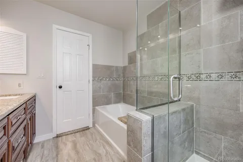 a bathroom with a bathtub and shower