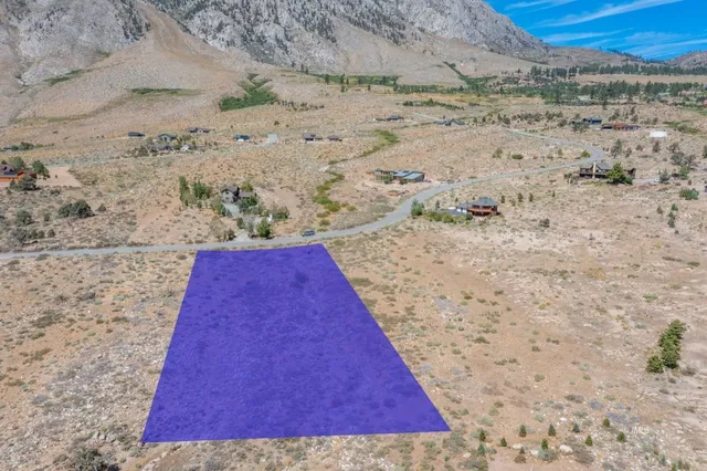 a view of swimming pool with wooden fence