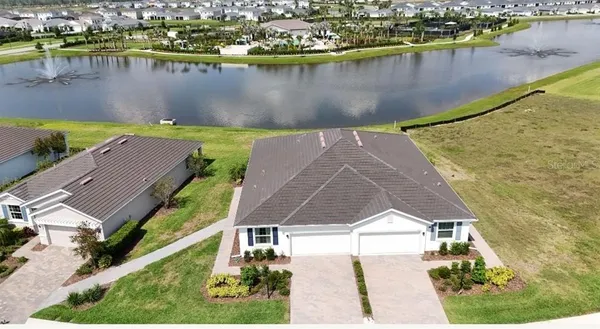 an aerial view of a house with a lake view