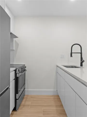 a bathroom with a shower a toilet and sink